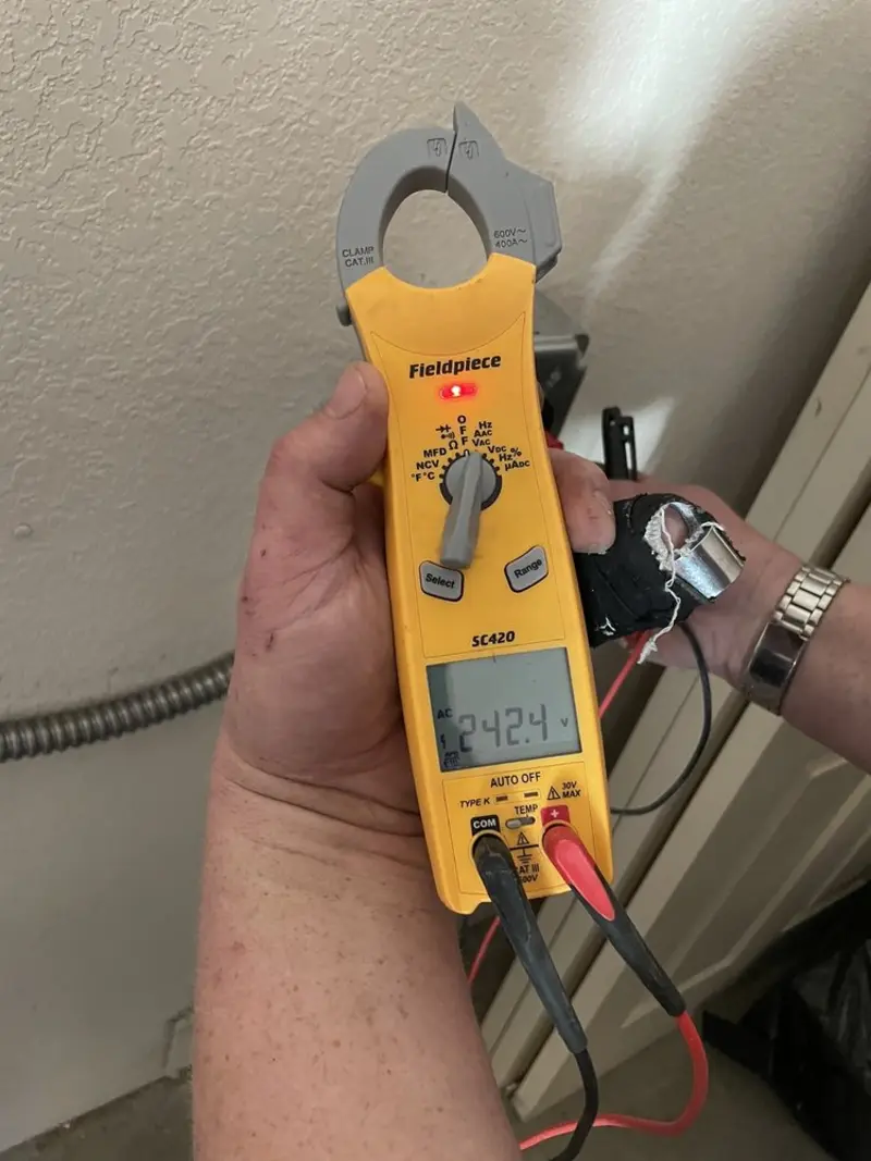 Voltage testing with clamp meter during Recessed Lighting Installation in Vine Grove